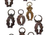 a lot of key chains that have different designs on them