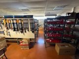 a room with a lot of skis on the shelves