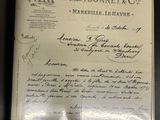 an old document with writing on it sitting on top of a table