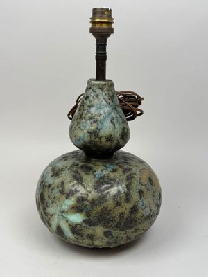 a lamp that is sitting on top of a stone
