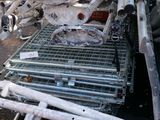 a pile of metal pipes and other items in the back of a truck