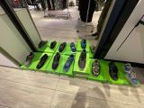 many pairs of shoes that are on display in a store