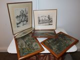 four framed pictures on a table with a picture of a castle