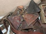 a lot of old leather items in a box