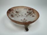 a glass bowl that is sitting on a table