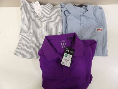 three men ' s shirts on a hanger in a store