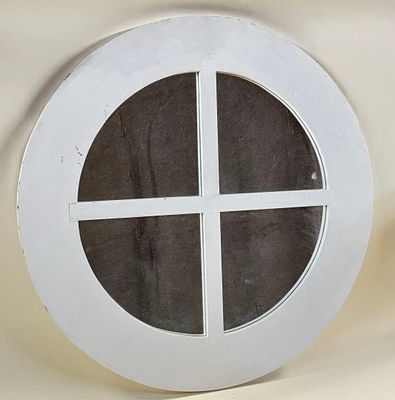 a picture of a round window on a wall