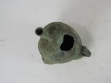 a small metal object with a hole in the middle of it