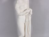 statue of a woman holding a bunch of flowers in her hands