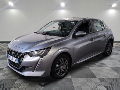 a silver car parked in a room with a checkered floor