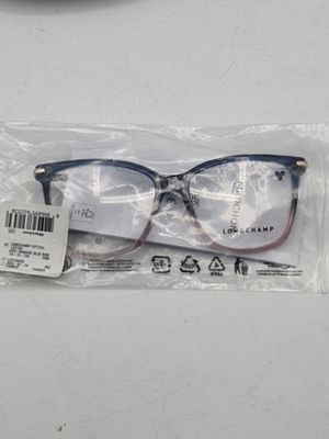 une paire de lunettes dans un sac en plastique posé sur une table