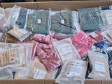 a cardboard box filled with assorted items in it