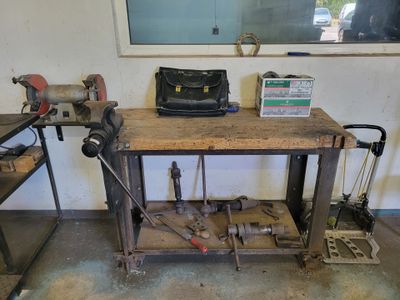 a workbench with tools on it in a garage