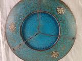 a clock that is on the wall with a blue background