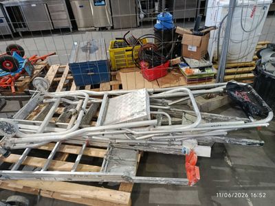 a pile of metal pipes and pipes on a pallet