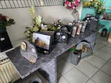 a table with a bunch of flowers and pictures on it