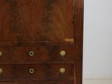 an image of a wooden cabinet with brass knobs