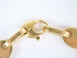 a close up of a gold keychain with two keys
