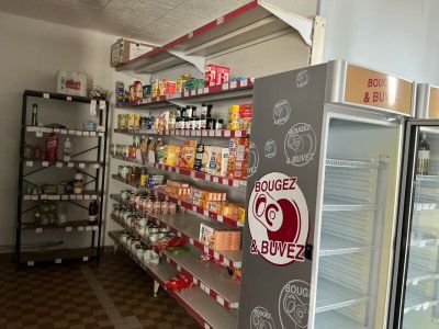 many shelves of food in the store for sale