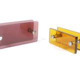 pair of pink and yellow glass door handles on a white background