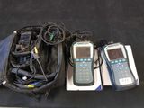 three cell phones in a bag on the floor