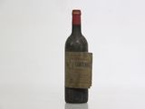 a bottle of wine that is sitting on a table
