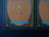 two cards with different designs on them on a table