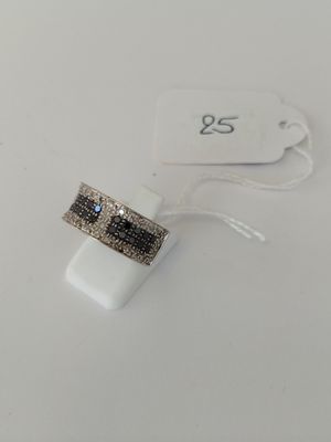 a close up of a ring on a white surface with a price tag
