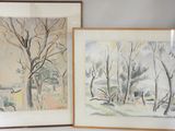 two framed pictures of trees in a room