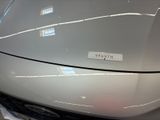 a close up of a car ' s hood with a sticker on it