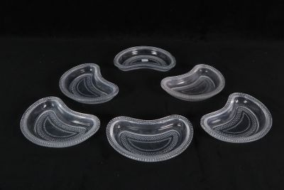 six clear plastic bowls are arranged in a circle on a black surface
