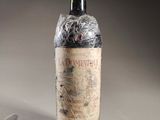 a bottle of wine that has been wrapped in plastic