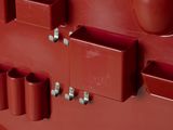 a red wall with a lot of different items on it