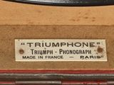 a sign on the back of a suitcase that says triumph