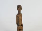 wooden statue of a man holding a dog on a white background