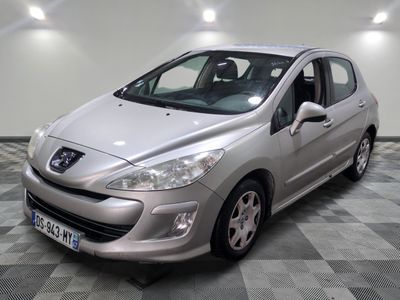 the small silver car is parked in a large room