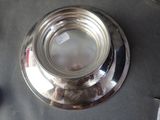 a silver plate with a label on it sitting on a table