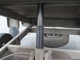 a close up view of a flatbed truck with a tire