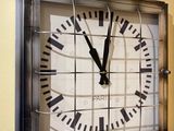 a clock that is hanging on the wall in the kitchen