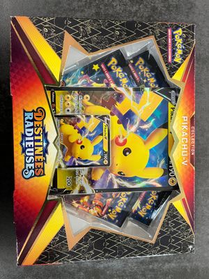 a box of pokemon cards sitting on top of a table