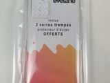 a close up of a packet of orange and pink dyes on a white surface