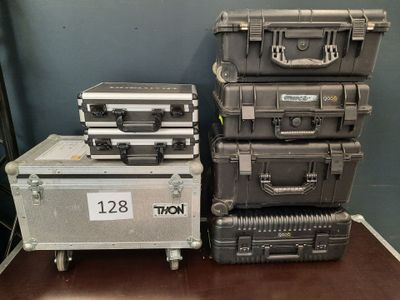 many suitcases stacked on top of each other on the floor