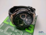a close up of a wrist watch on a piece of circuit board