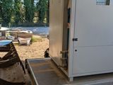a small trailer with a small refrigerator on the back of it
