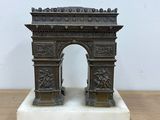 an image of a statue of a gate on a wooden table