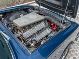 a small engine in the trunk of a blue car
