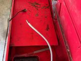 a red box that has a hose in it