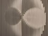 a close up of a piece of paper with a hole in it