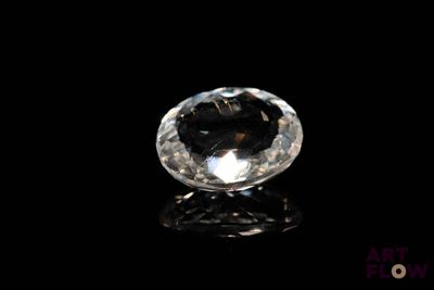 a close up of a diamond on a black surface