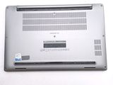 a silver laptop with a blue sticker on it